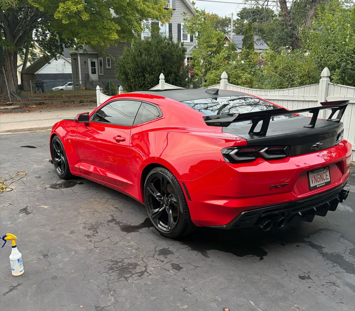 Red Chevrolet Camaro with a gleaming freshly detailed finish
