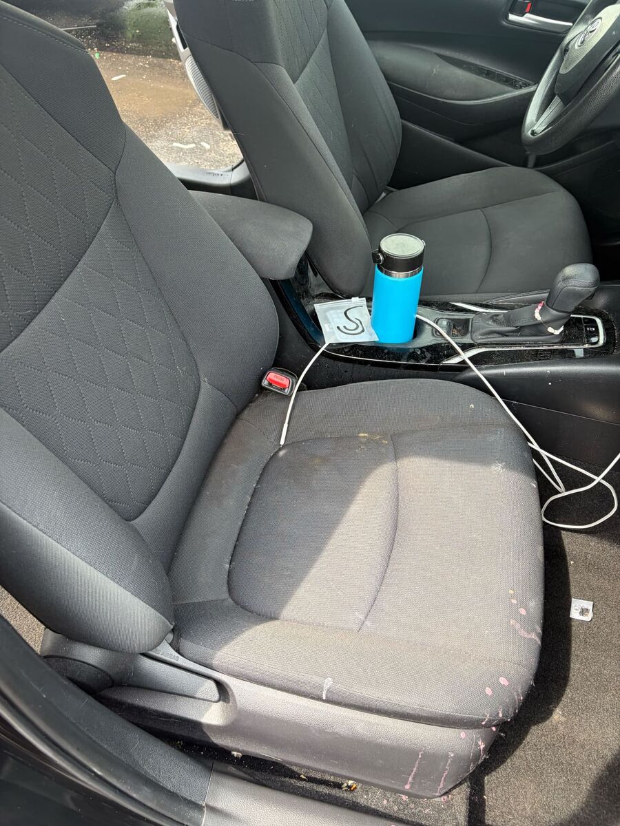Stained fabric car seat before interior detailing